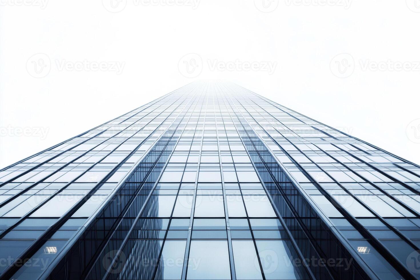 Skyscraper reaching into a foggy sky in an urban setting photo