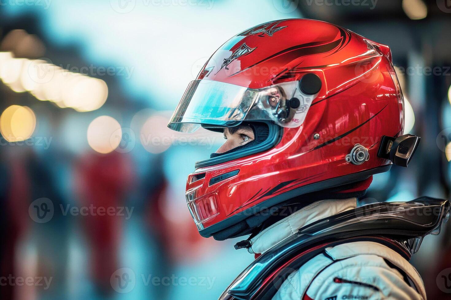 Race car driver preparing for competition at a motorsport venue photo