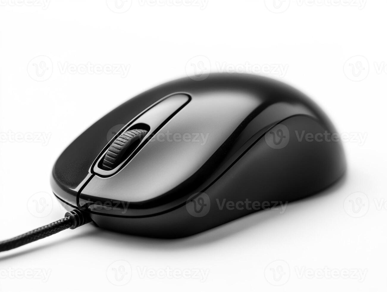 Black computer mouse on a white surface with a sleek design photo