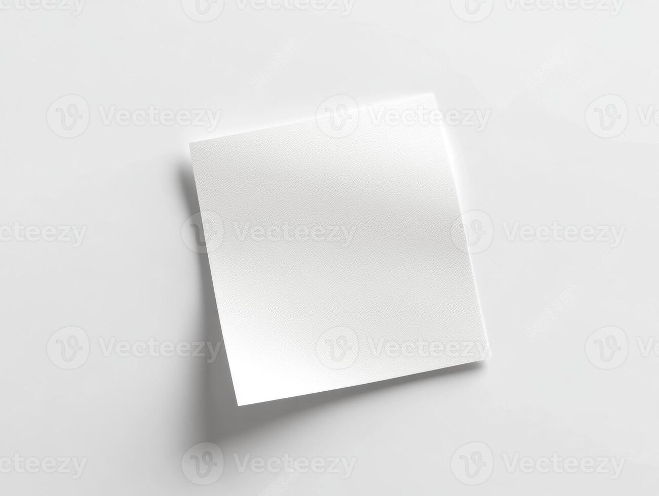 Blank sticky note on a clean white surface for notes photo