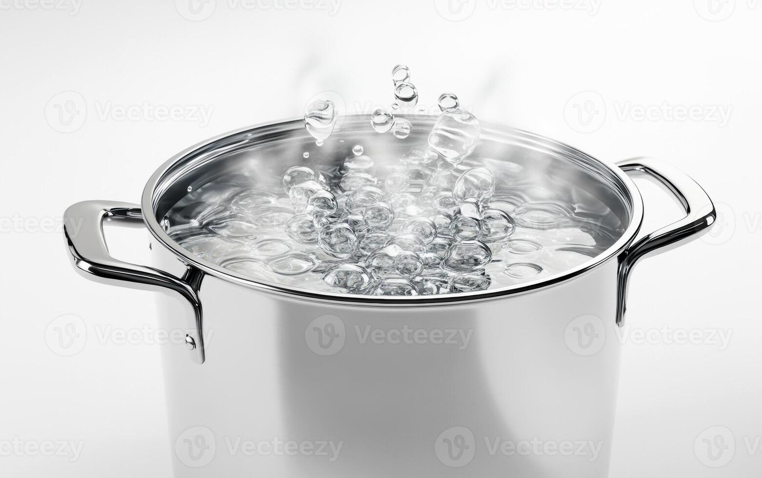 Boiling water in a stainless steel pot on a clean kitchen surface photo