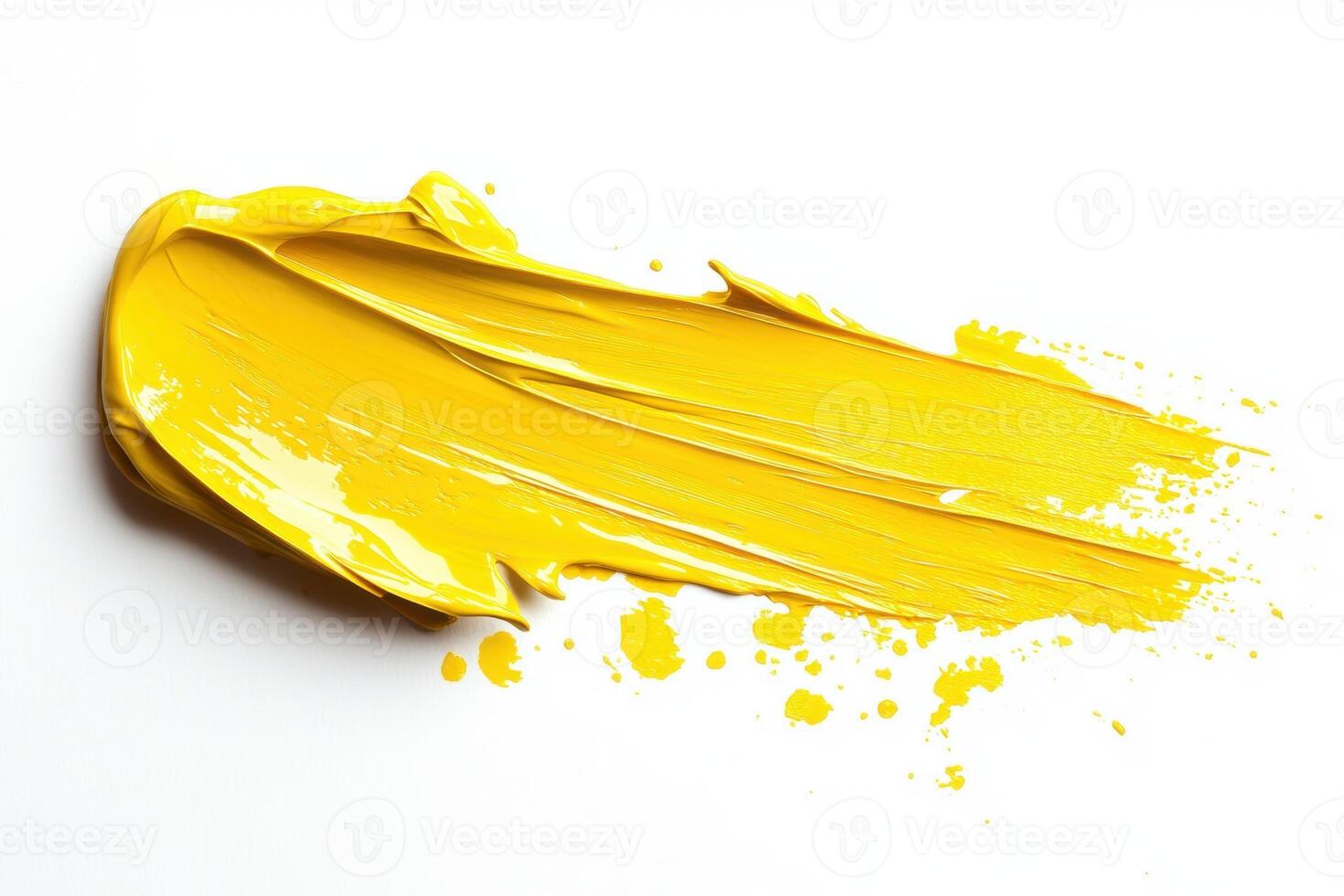 Yellow paint splattered on white during creative work photo