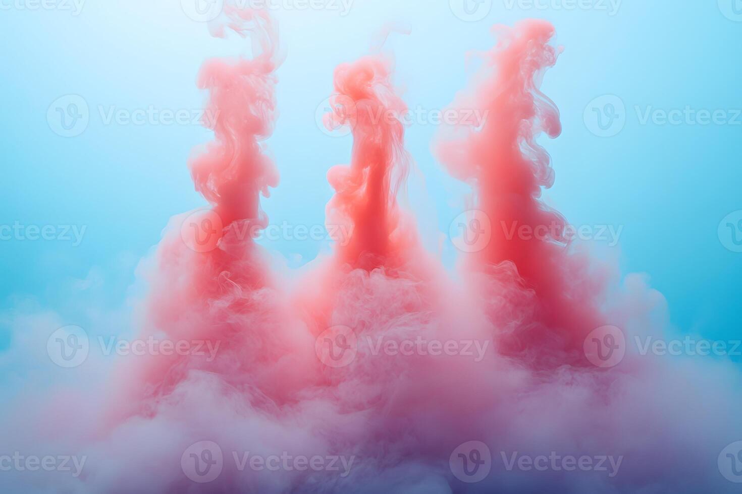 Vivid Pink Smoke Plumes in Blue Background for Artistic Abstract Design photo