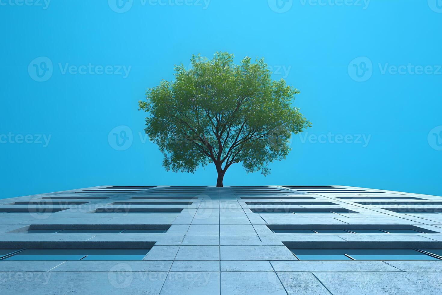 Urban Nature Concept Tree Growing from Skyscraper Against Clear Blue Sky photo