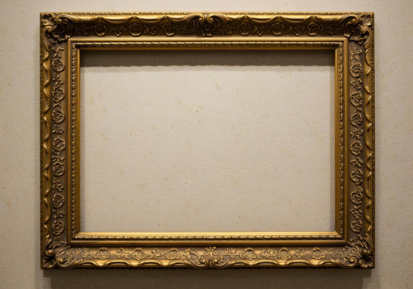 Old antique gold frame on white wall background. Vintage picture frame. photo
