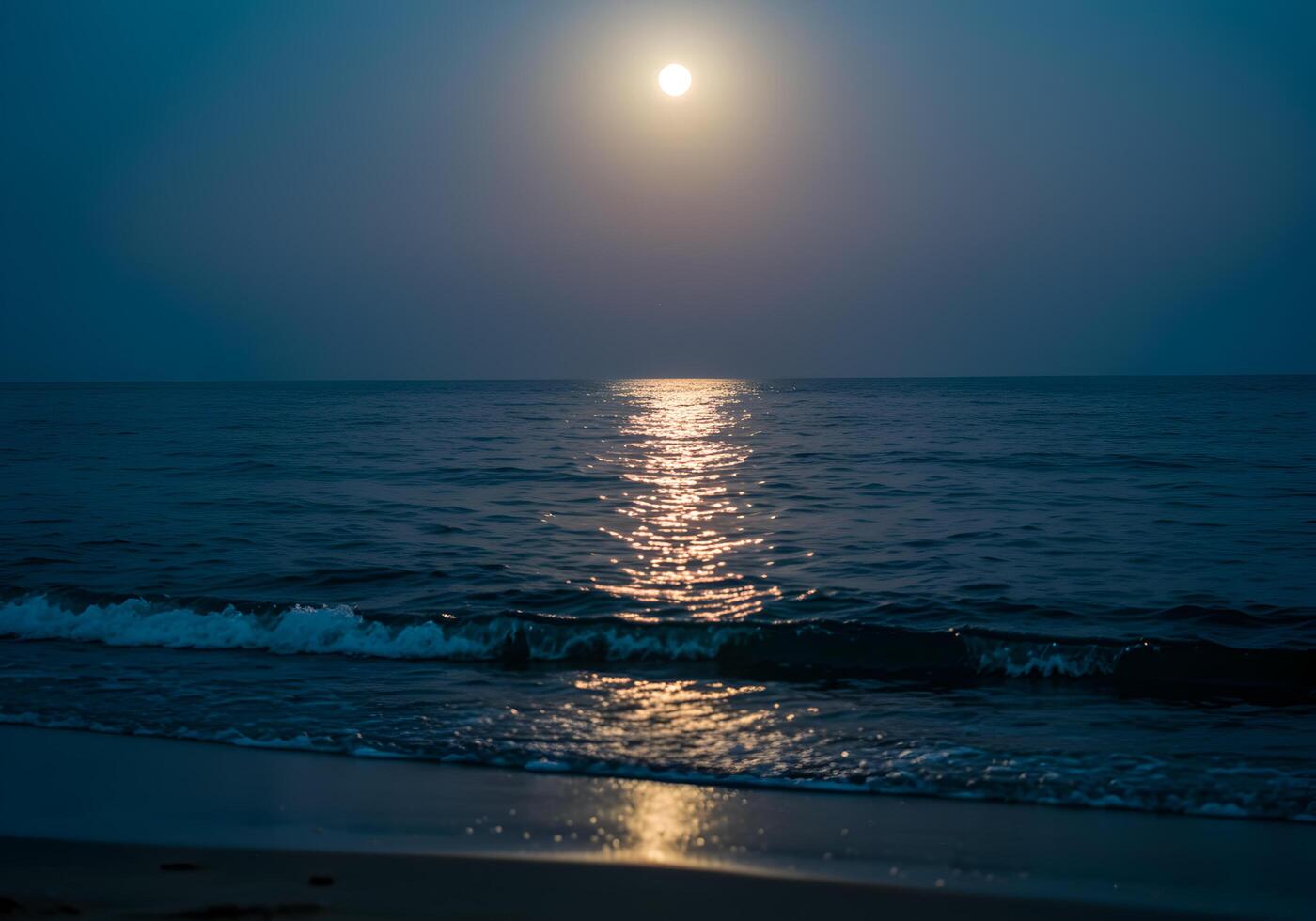 Full moon over the sea in the evening. The moon reflected in the water. photo