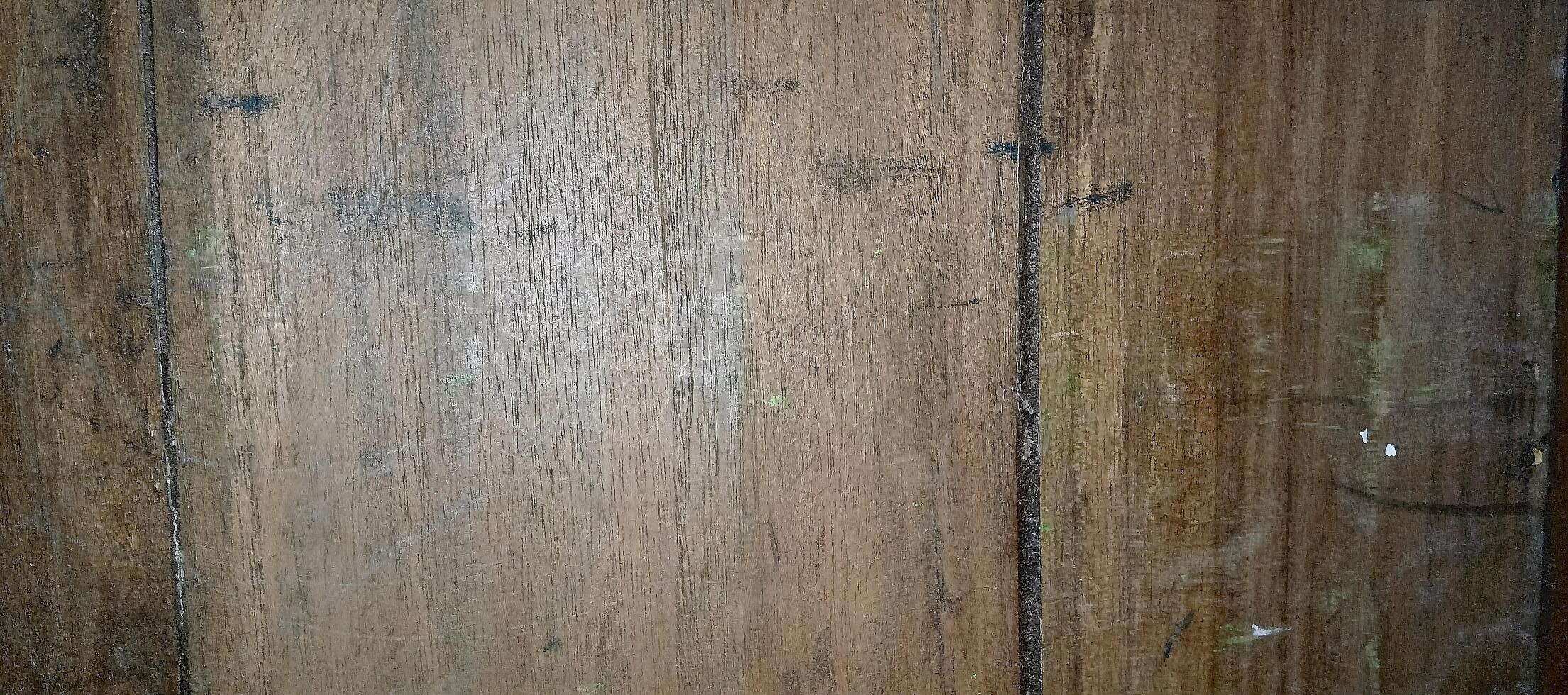 A close up of a wooden wall with some paint on it photo