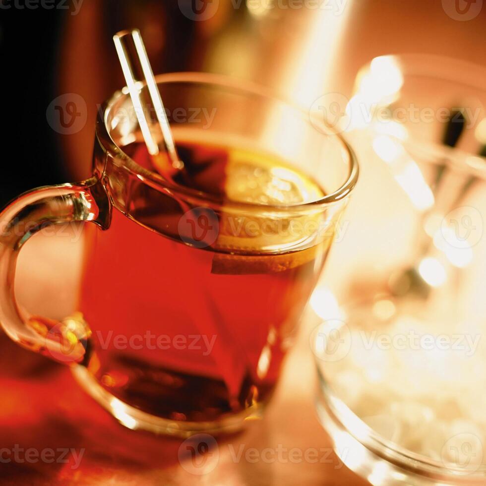 A glass of tea with a straw in it photo