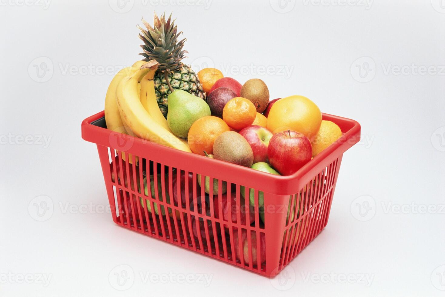 A red basket filled with fruit photo