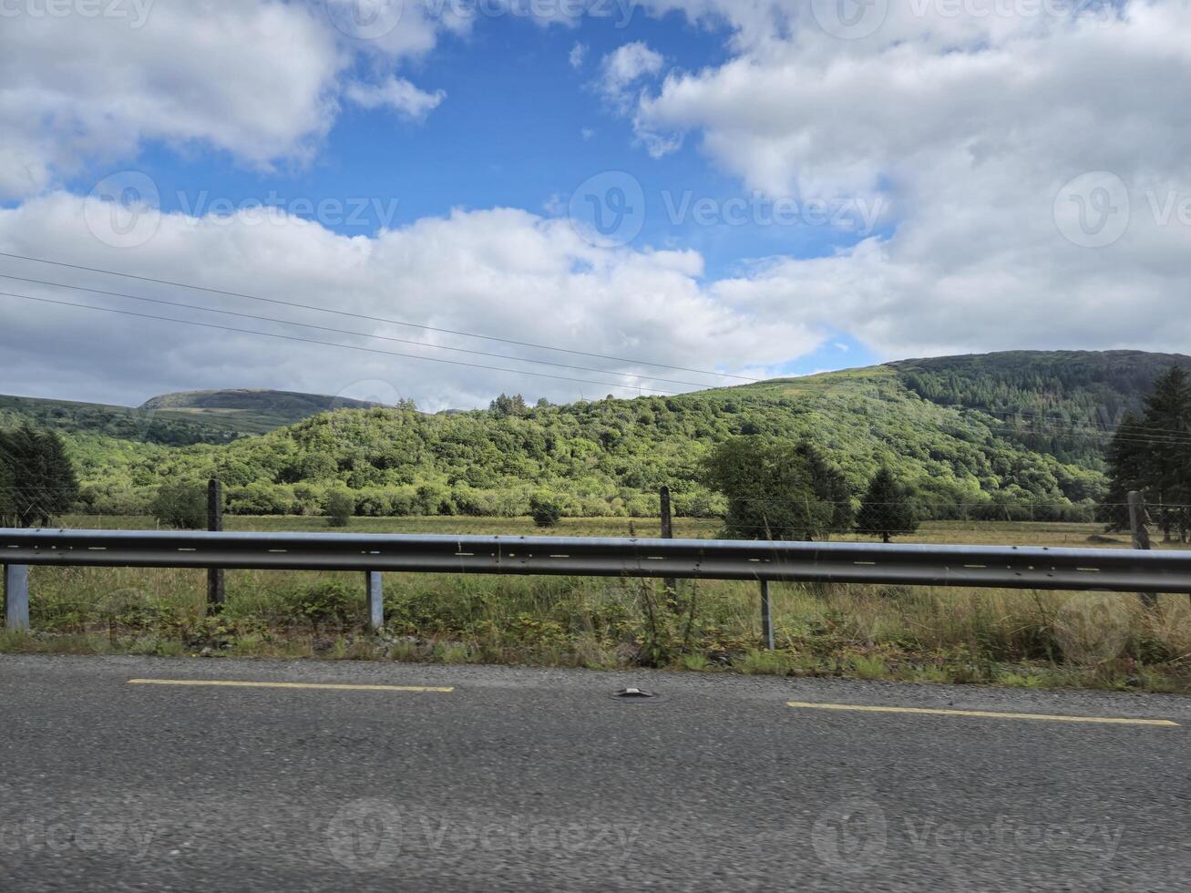 A view of a highway with a sign that says stop photo