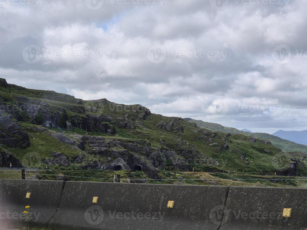 A view of a mountain from a car window photo