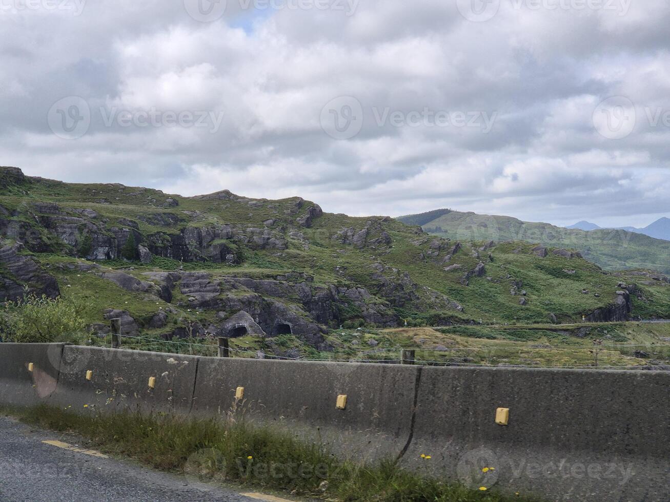 A view of a road with a mountain in the background photo