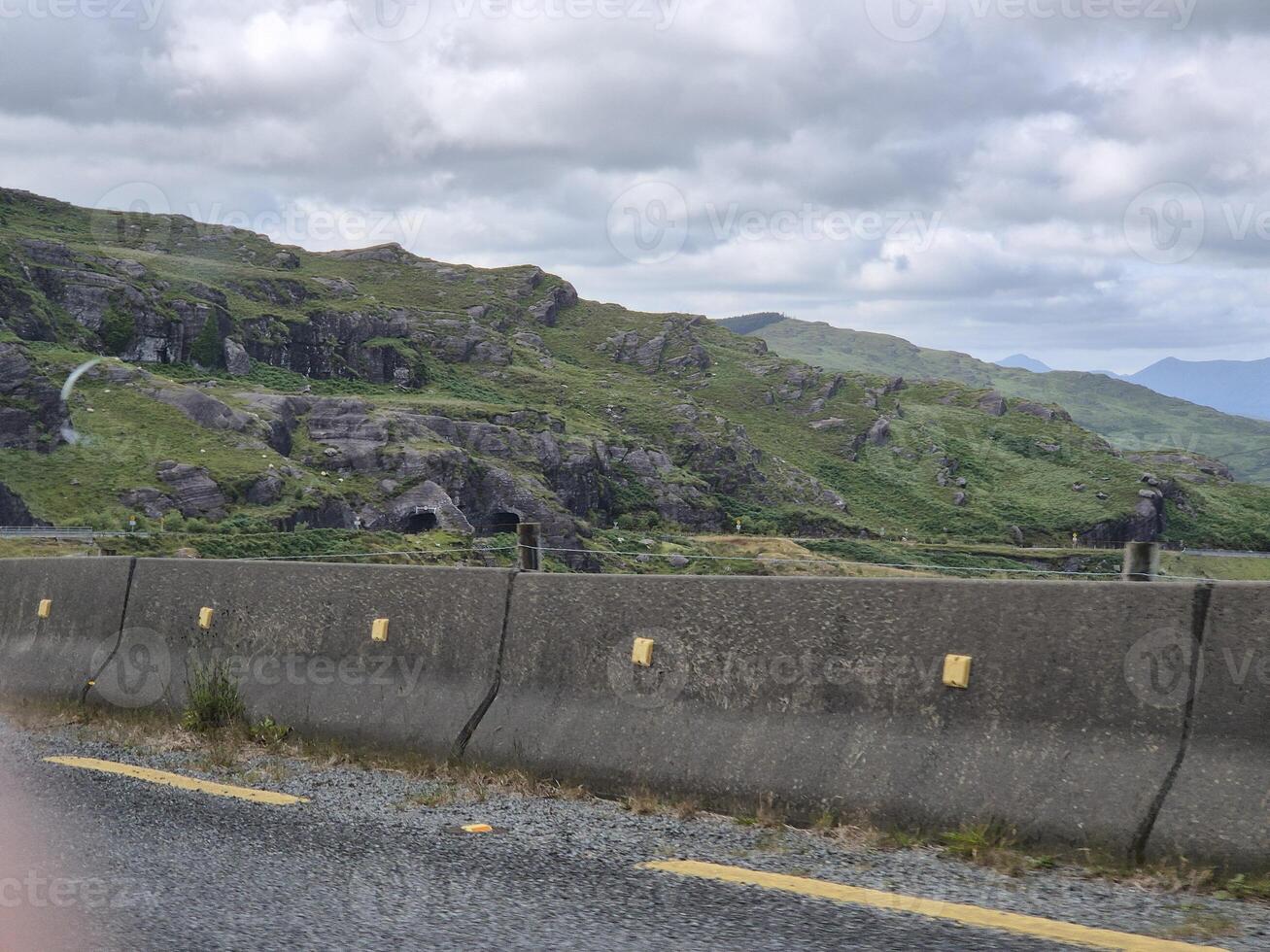 A view of a mountain from a car window photo