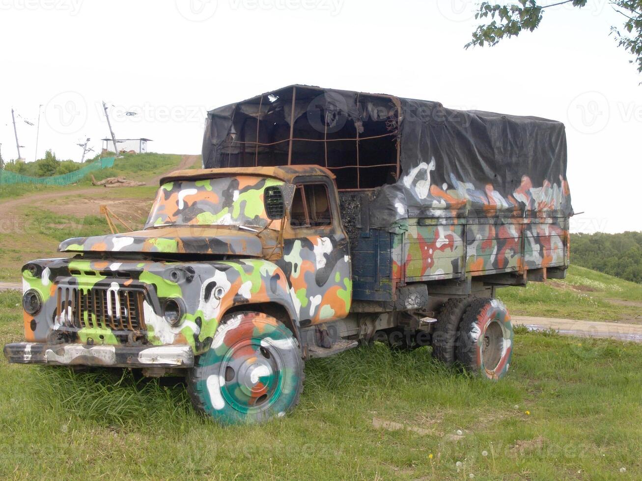 Old Military Truck with Colorful Camouflage Paint wallpaper photo