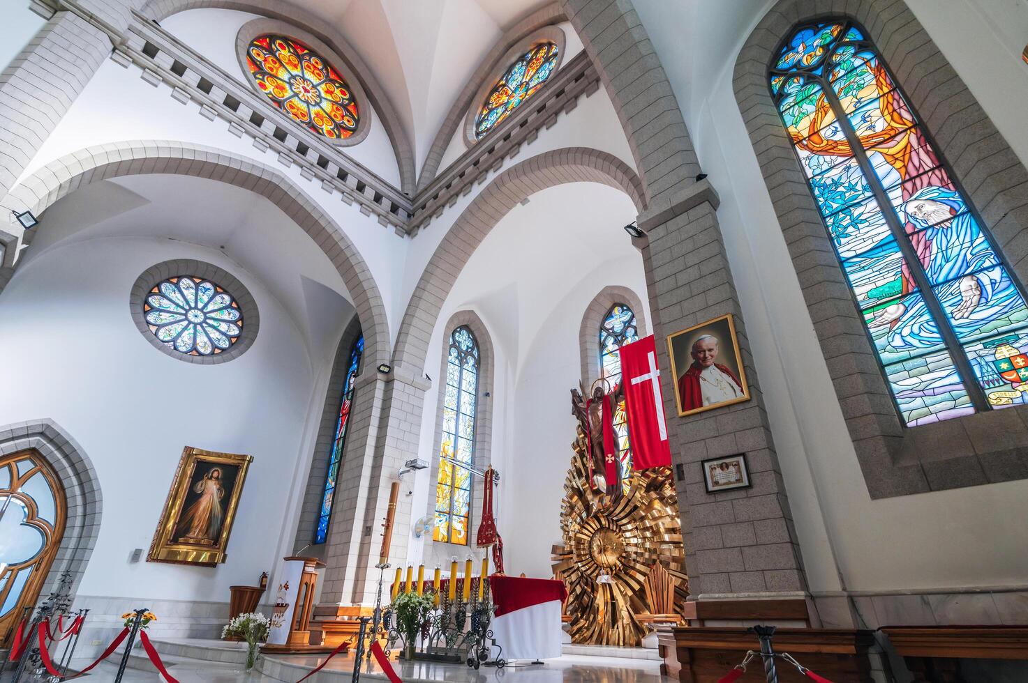 Interior of white Catholic church. Sacred Heart of Jesus Cathedral. Tashkent, Uzbekistan - April 18, 2024 photo