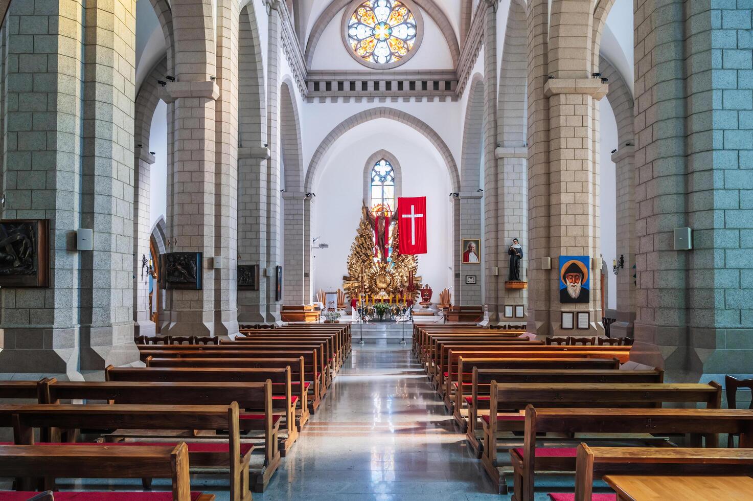 Interior of white Catholic church. Sacred Heart of Jesus Cathedral. Tashkent, Uzbekistan - April 18, 2024 photo