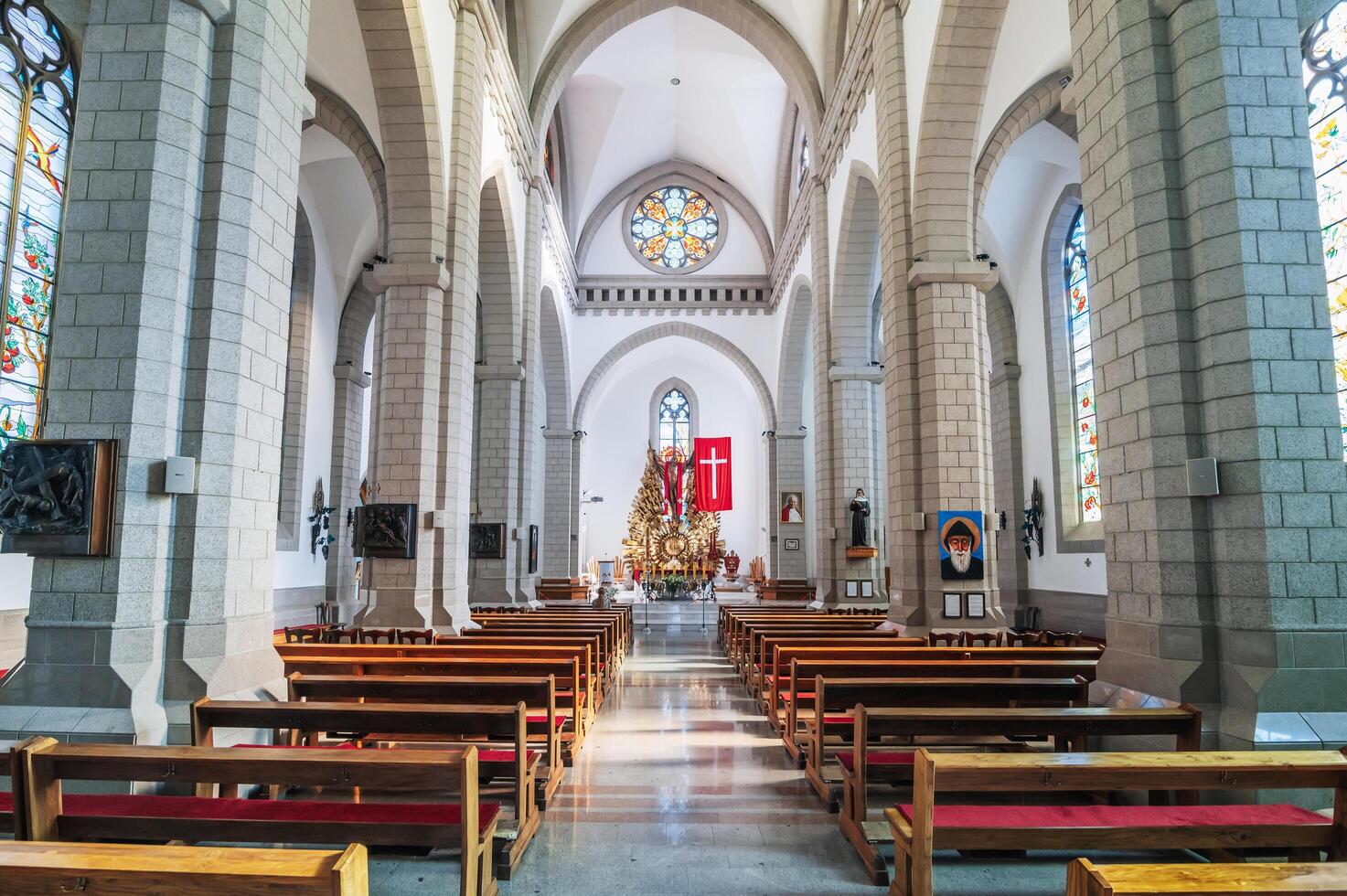 Interior inside of white Catholic church. Sacred Heart of Jesus Cathedral. Tashkent, Uzbekistan - April 18, 2024 photo