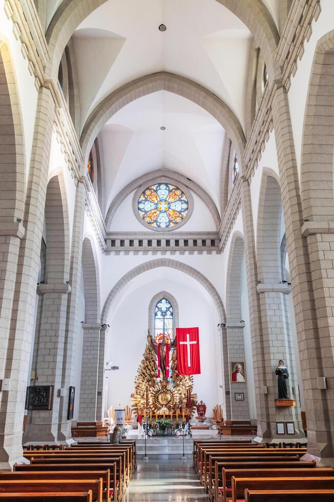 Interior of Christian Roman Catholic church. Sacred Heart of Jesus Cathedral. Tashkent, Uzbekistan - April 18, 2024 photo