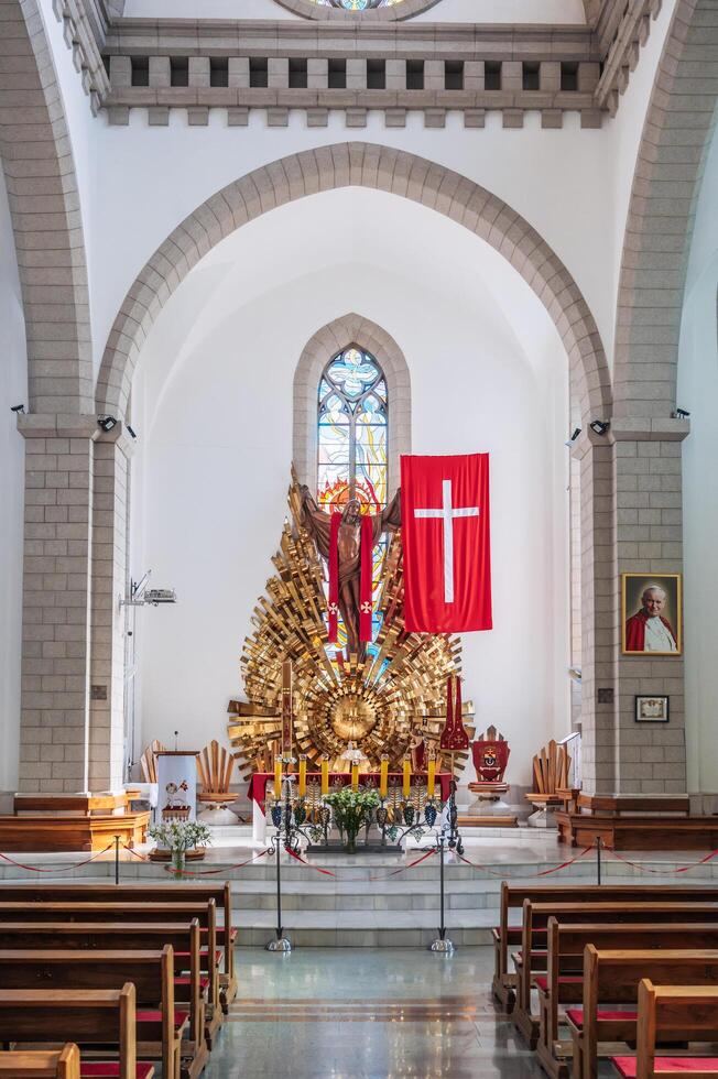 Altar with Jesus Christ in interior of Christian Catholic church. Cathedral of Sacred Heart of Jesus. Tashkent, Uzbekistan - April 18, 2024 photo