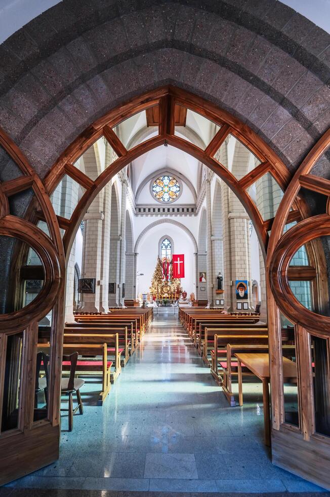 Interior of Christian Roman Catholic church. Sacred Heart of Jesus Cathedral. Tashkent, Uzbekistan - April 18, 2024 photo