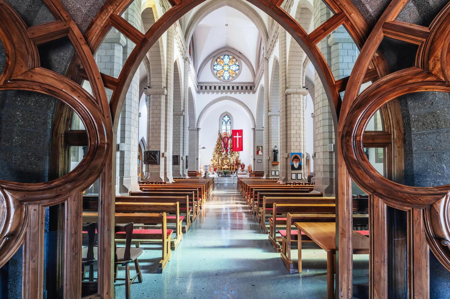 Interior of Christian Roman Catholic church. Sacred Heart of Jesus Cathedral. Tashkent, Uzbekistan - April 18, 2024 photo