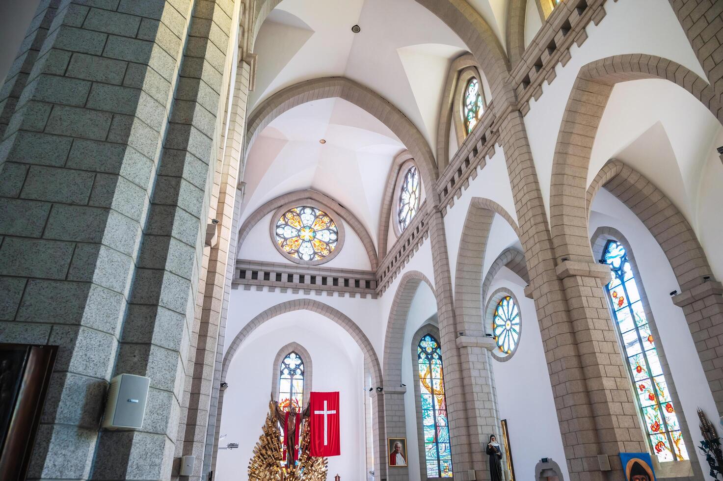 Interior inside of white Catholic church. Sacred Heart of Jesus Cathedral. Tashkent, Uzbekistan - April 18, 2024 photo