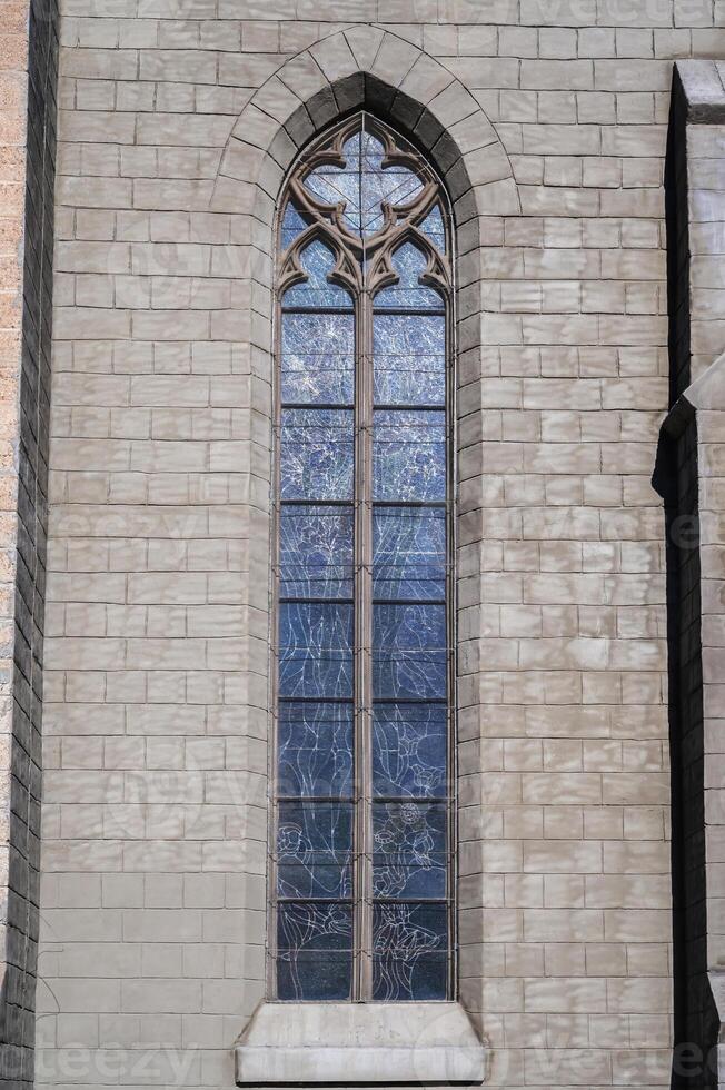 window in stone wall of Cathedral of the Sacred Heart of Jesus in Tashkent in Uzbekistan photo