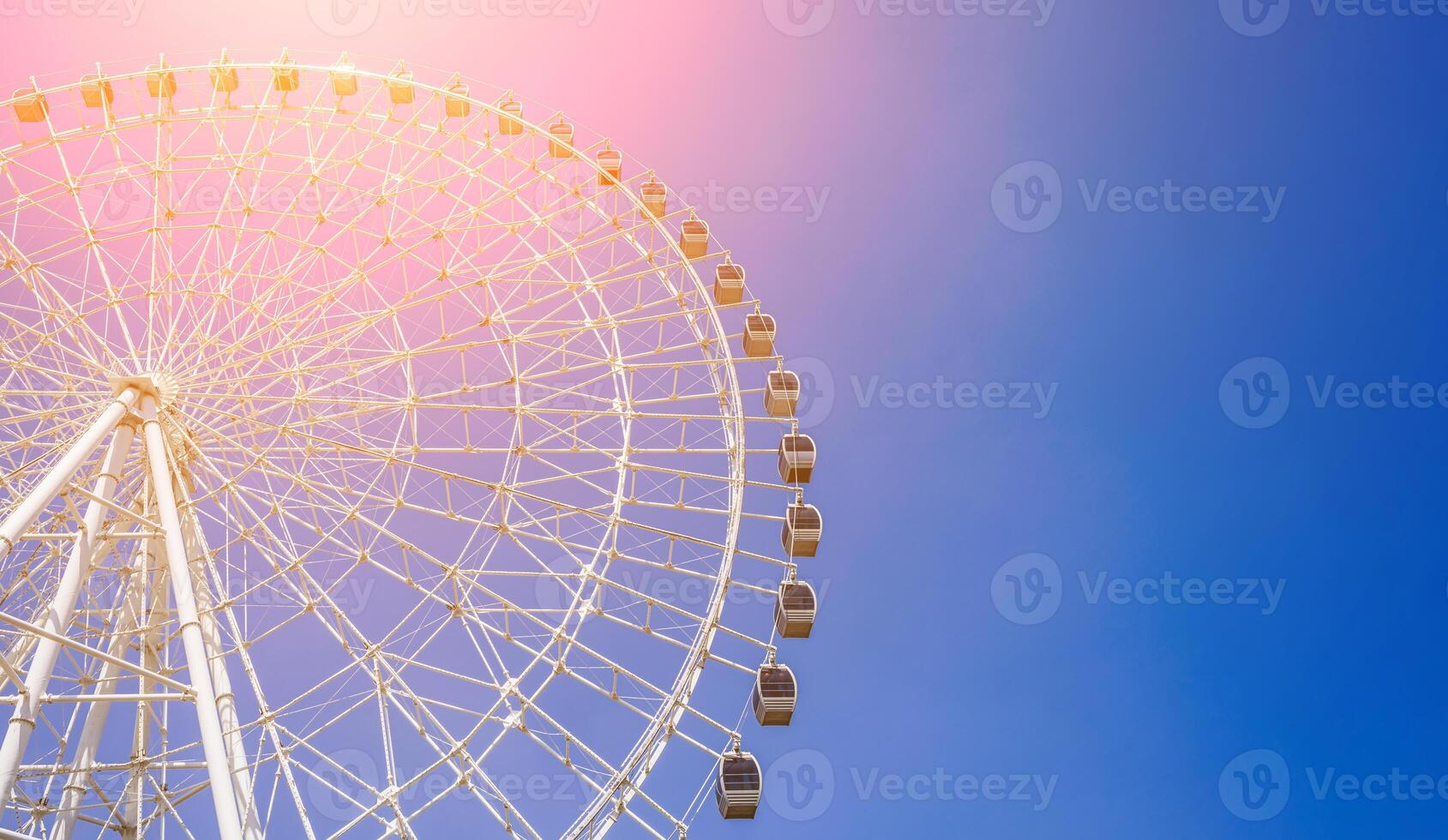 white big Ferris wheel on background a blue sky in amusement park in summer with copy space photo