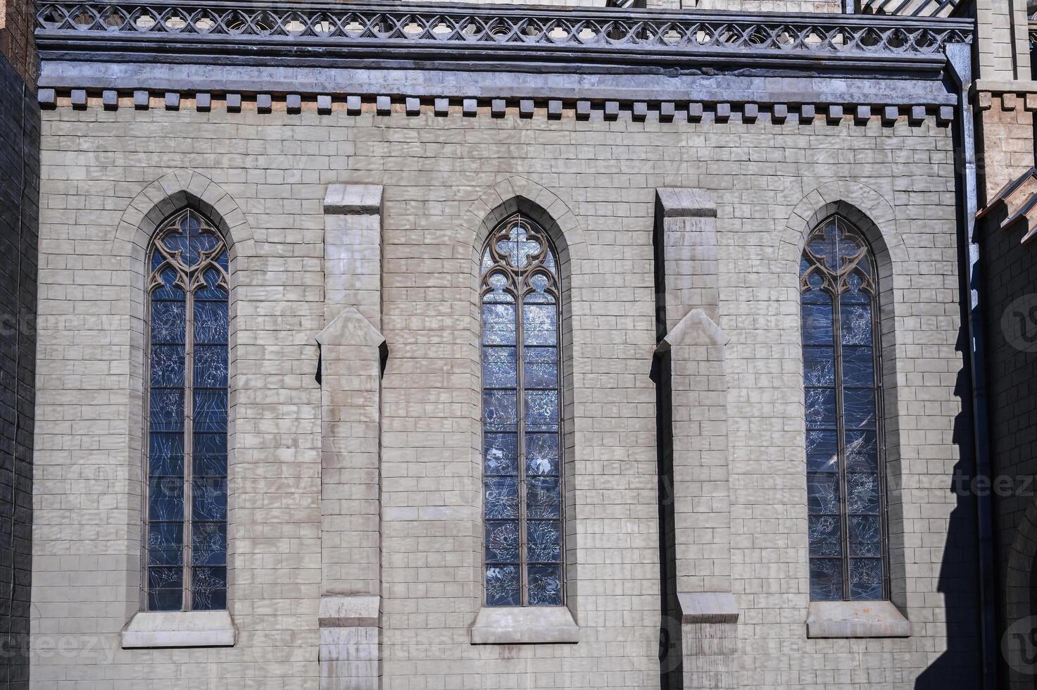 windows in stone wall of the Cathedral of the Sacred Heart of Jesus in Tashkent in Uzbekistan photo