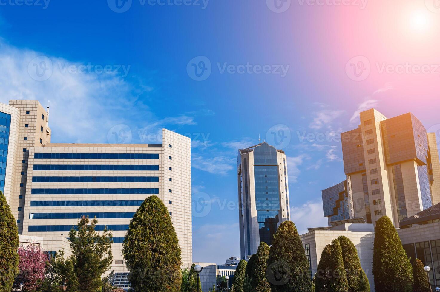 a complex of modern buildings on a sunny summer day photo