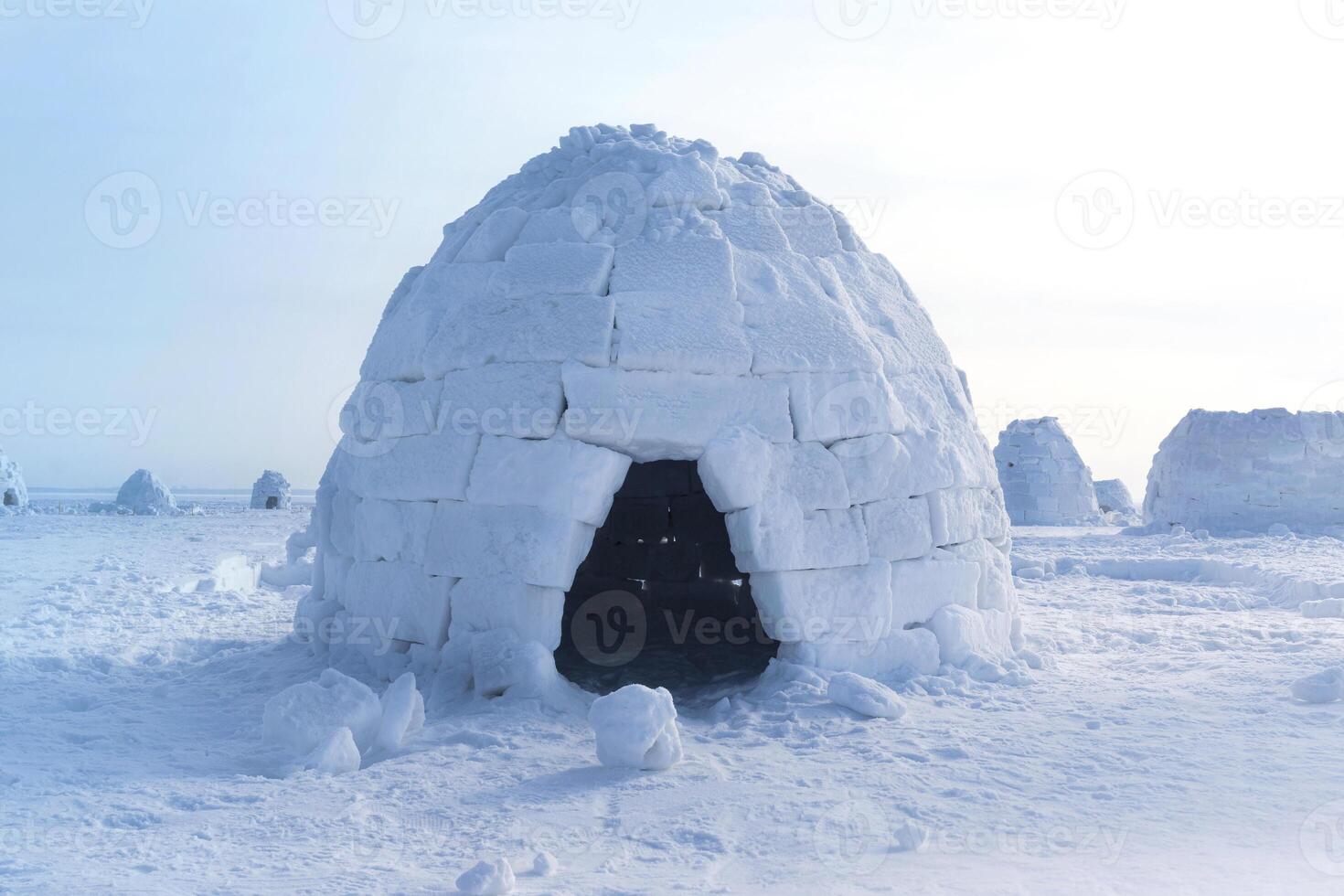 Igloo holiday. Eskimo dwelling made of ice and snow. Igloo home from snow photo