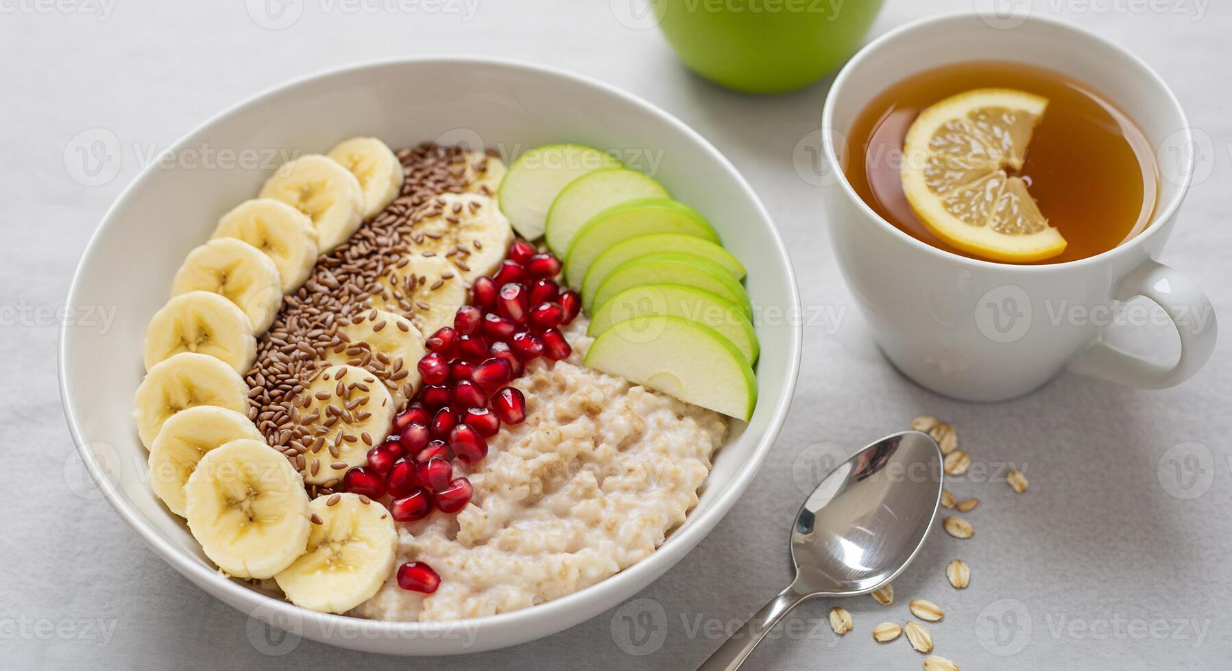 Healthy breakfast bowl with oats, banana, pomegranate, apple, pomegranate photo