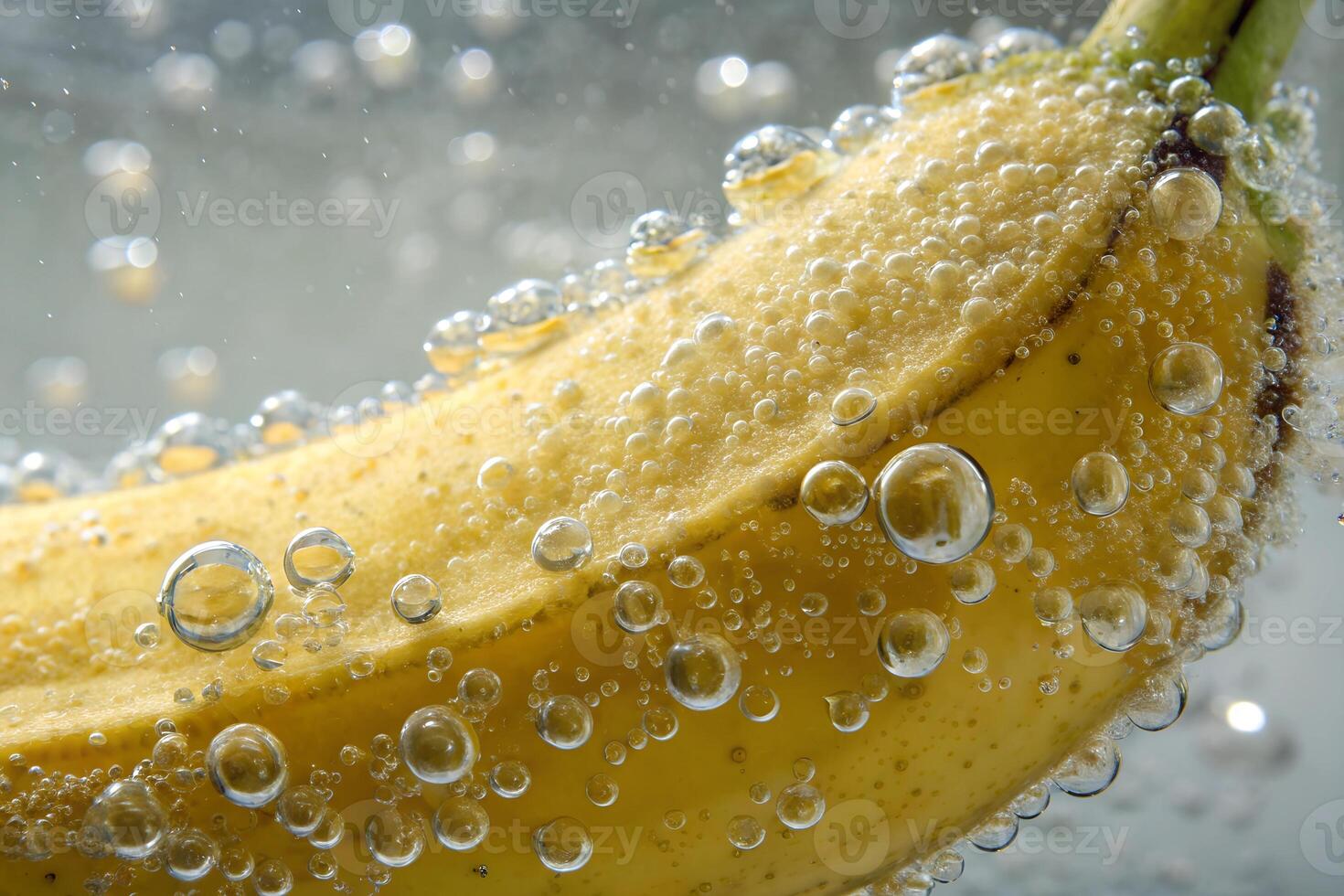 Ripe banana covered with bubbles in sparkling water photo