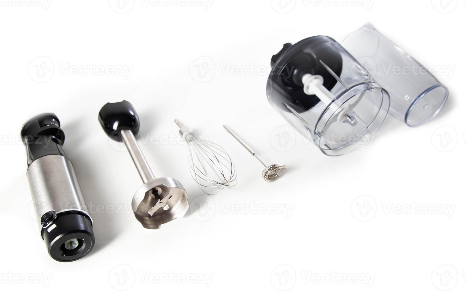 Modern set for immersion blender with whisk, milk frother and bowl on white background. Modern household appliances photo