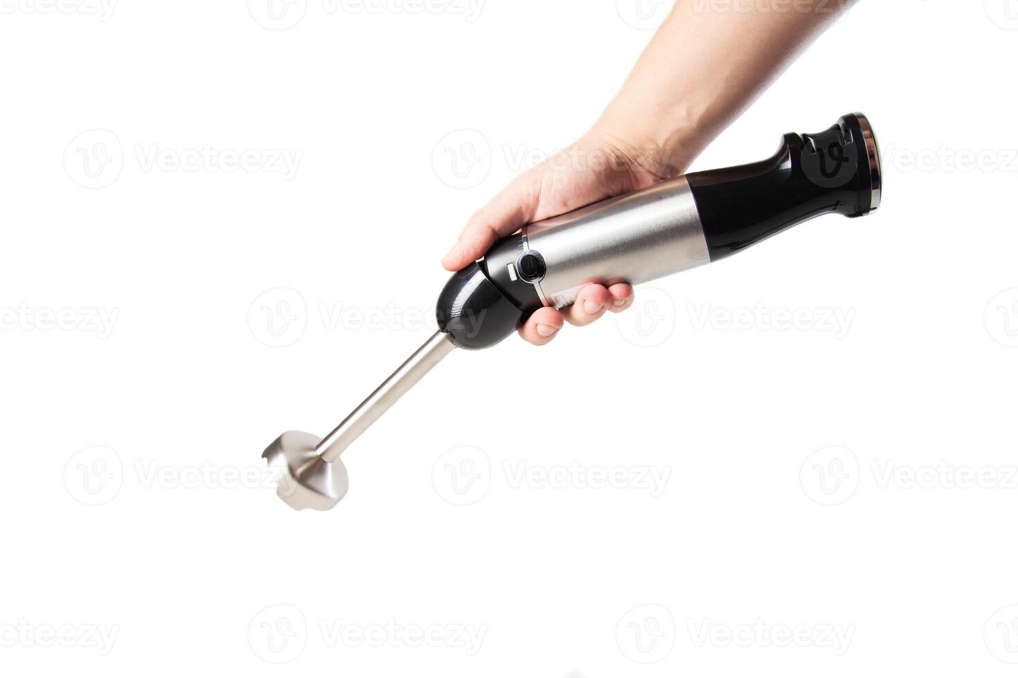 Modern immersion blender with a chopper in hand on a white background photo