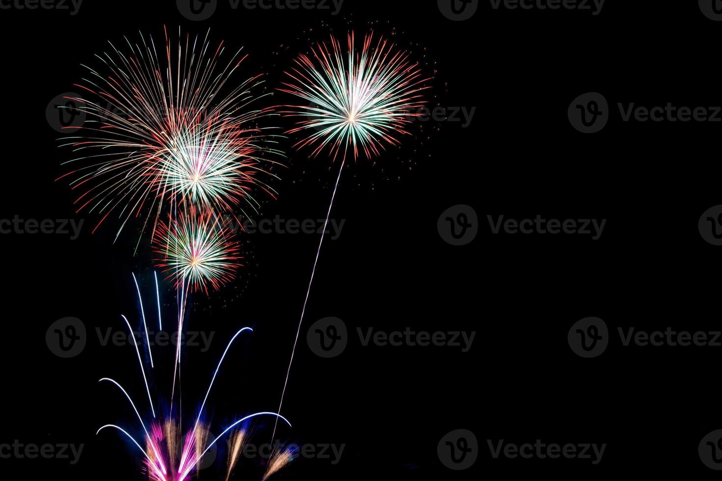 Colorful fireworks display in night sky, great for graphic background photo