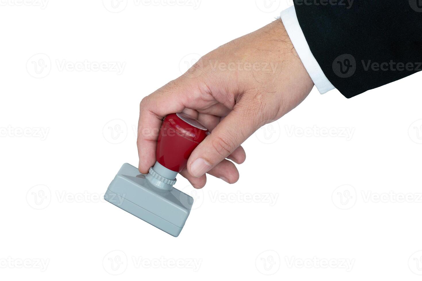 Hand stamping a document during office work for verification purposes photo