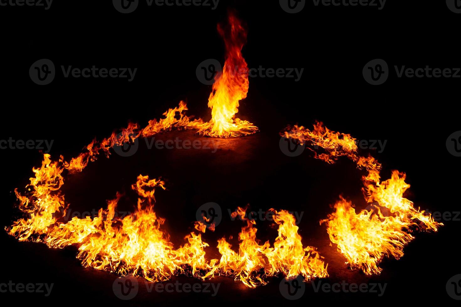 Spectacular display of fire forming a mesmerizing Ring of Fire in a dark setting photo