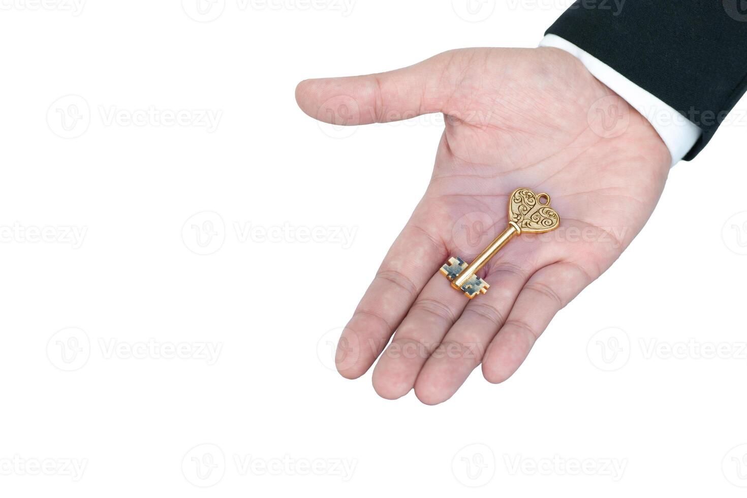 Holding a golden key in hand signifies potential and new opportunities for unlocking futures photo