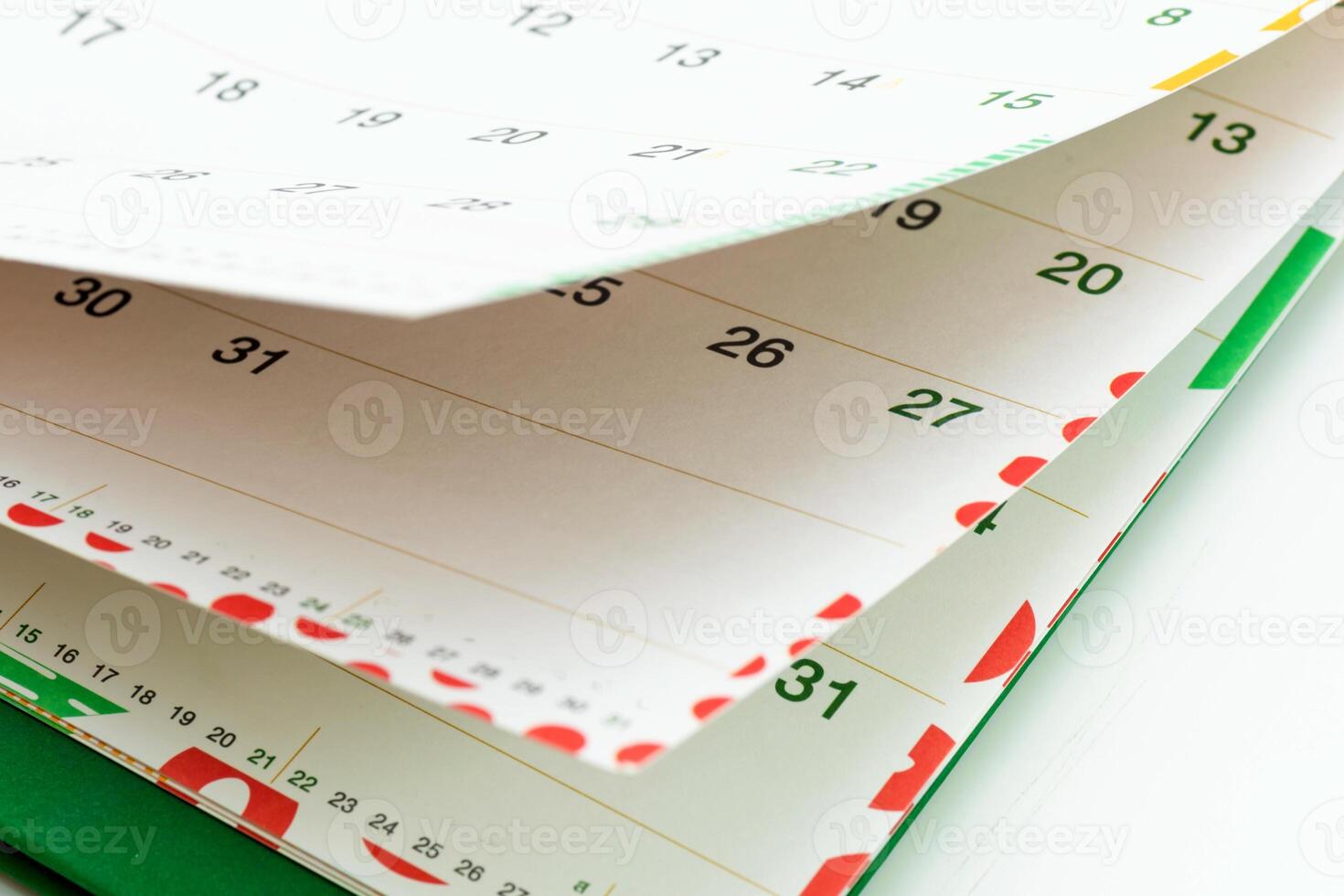 Closeup view of calendar pages showing days and dates for planning activities and events photo