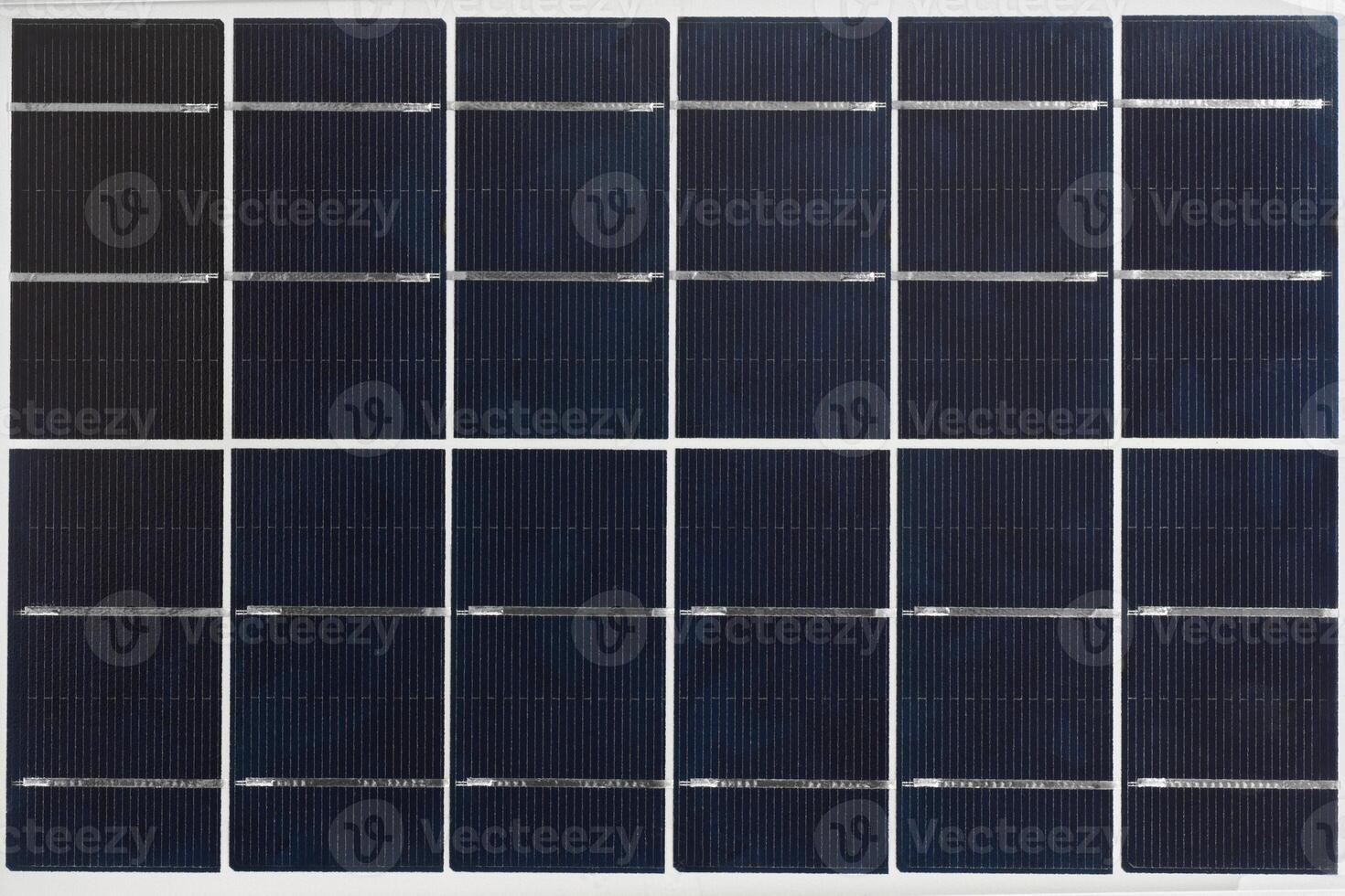 Closeup of a textured solar panel revealing intricate energy collection patterns photo