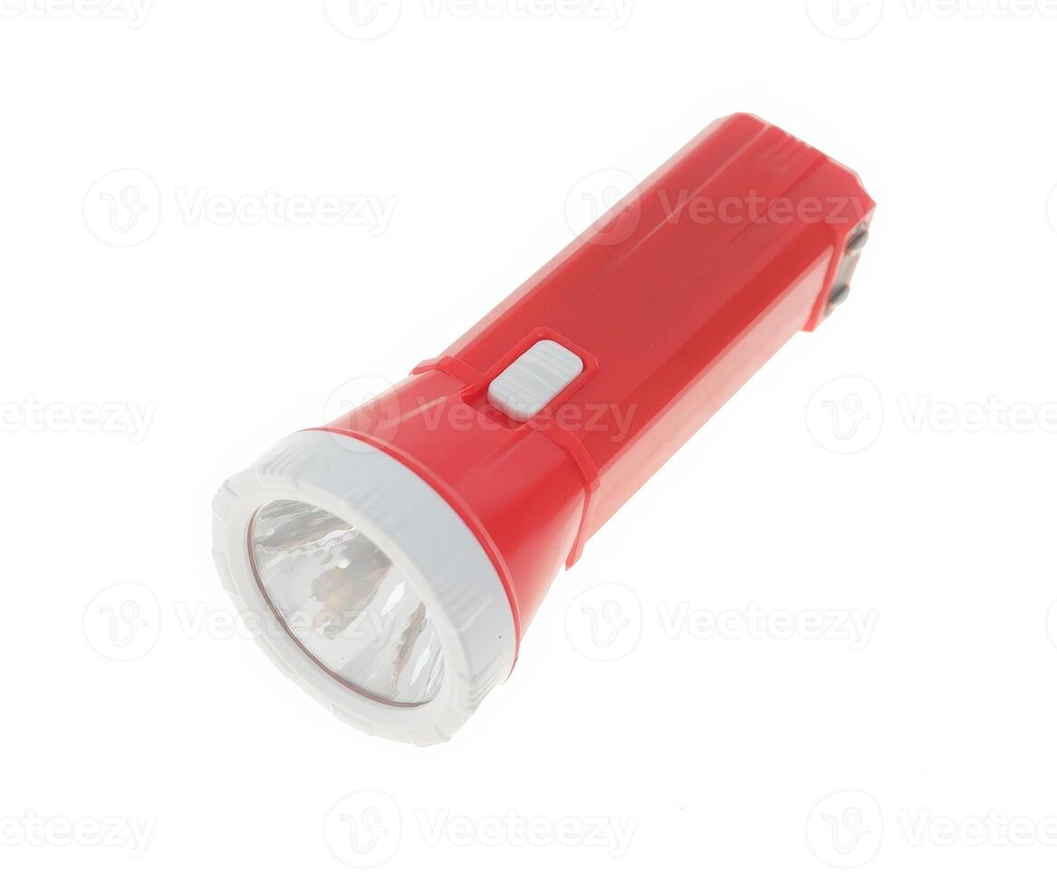 Plastic LED flashlight in red color. Portable flashlight isolate on a white background. photo