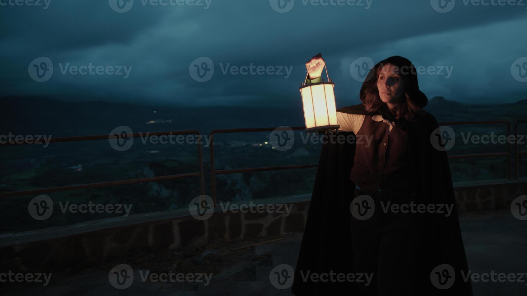 Woman Walks Mysteriously In A Square At Night Among The Darkness Of The Crime photo