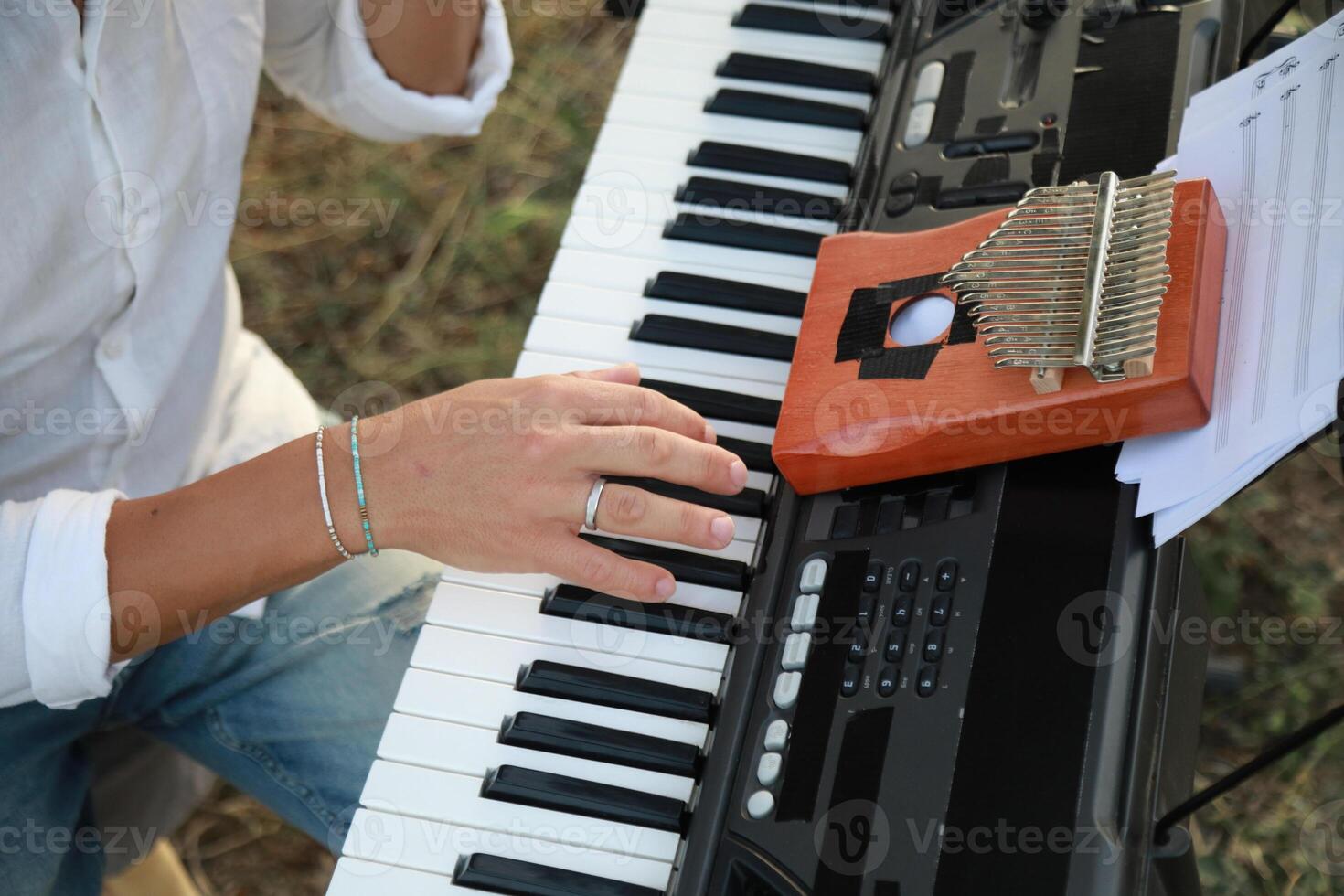 Piano Tuning Tool Used By Man Close Up photo