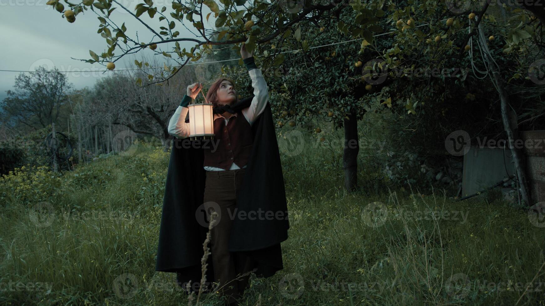 Mysterious Woman Collects Fruits to Perform Esoteric Ritual in the Countryside photo