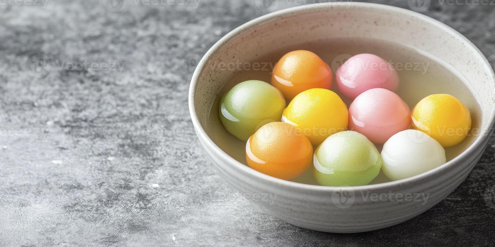 Colorful eggs in a bowl of water photo