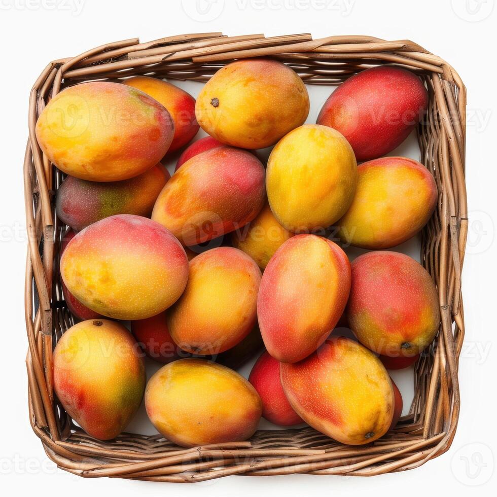 A basket of ripe, colorful mangoes with vibrant red and yellow hues. photo