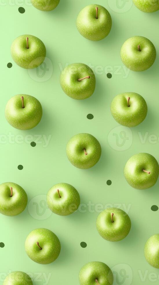 Vibrant green apples arranged in a symmetrical pattern on a soft green background with scattered dots. photo