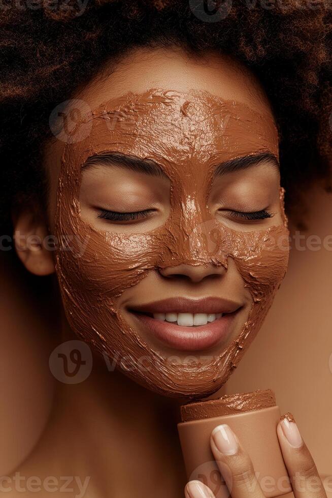 Smiling woman with clay face mask enjoying a skincare routine, eyes closed. photo