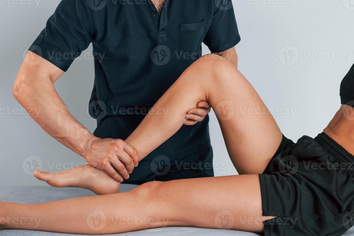 Laying. down on the table. Woman visiting physiologist that making massages and helping with traumas photo